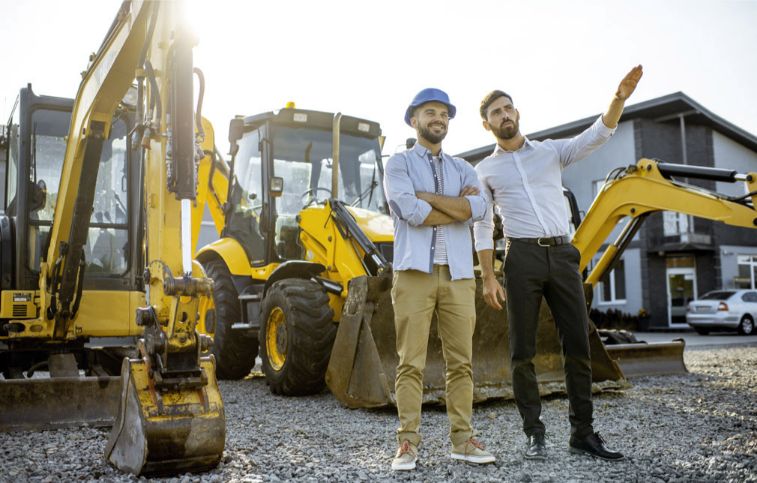 Two men discuss mining stocks.